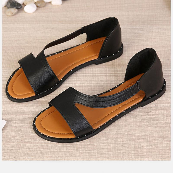 Trendy white open-toe sandals, a stylish and elegant footwear choice for ladies this summer.