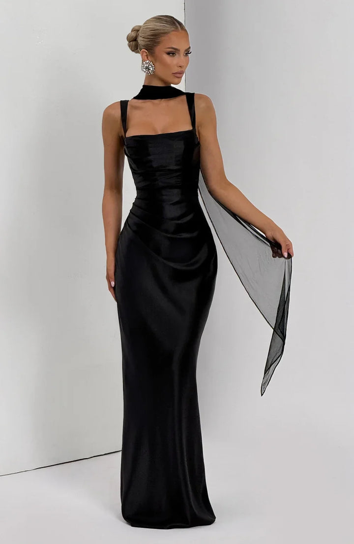 Full-length black ruched waist maxi dress for women, designed for summer elegance. Features adjustable straps.