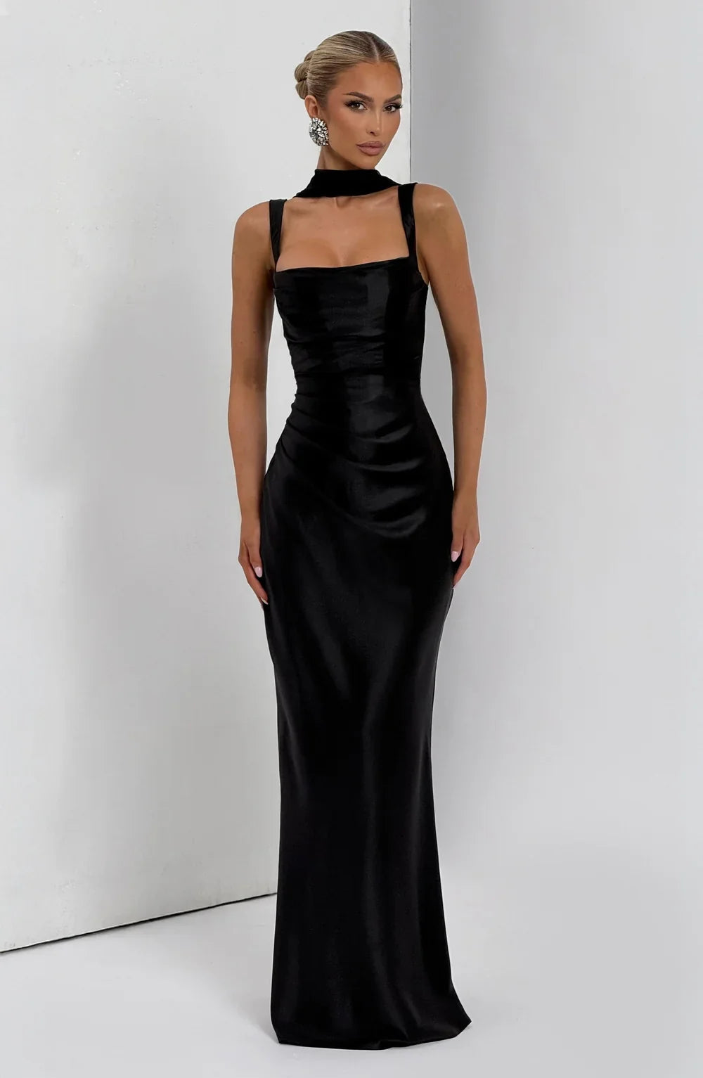 Chic black women's maxi dress with an elegant ruched waist and adjustable straps, perfect for summer outings.