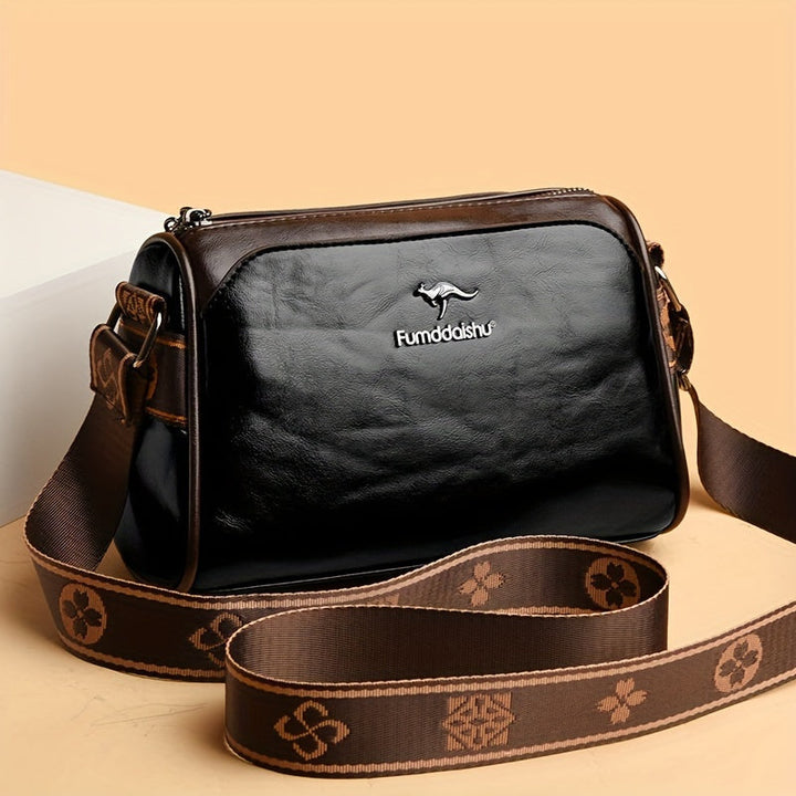 Elegant black women's shoulder bag with adjustable strap & chic design. Perfect for everyday fashion.