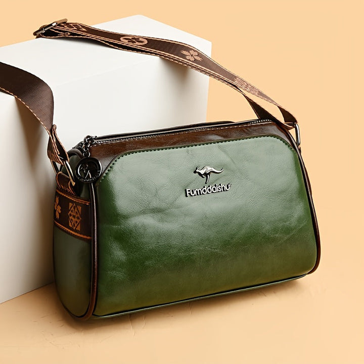 Modern beige shoulder bag for women. Chic, elegant, & organized, with an adjustable strap for a fashionable look.