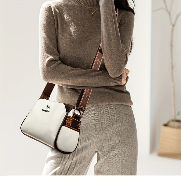 Green women's elegant shoulder bag with a functional adjustable strap. Ideal for versatile fashion & accessories.