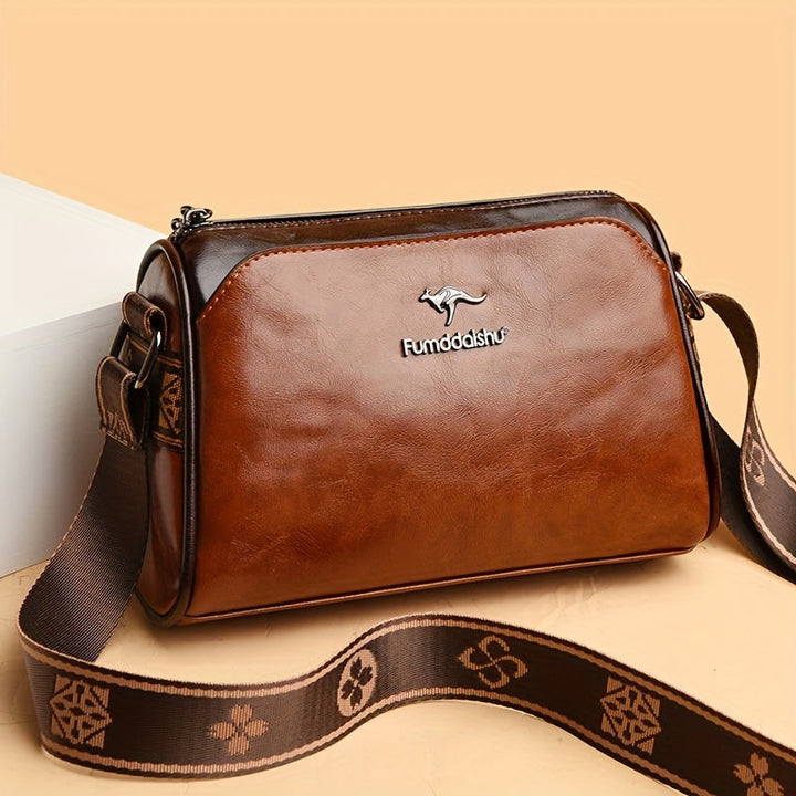 Classic black women's shoulder bag, elegant design & organized compartments. Adjustable strap for versatile style.