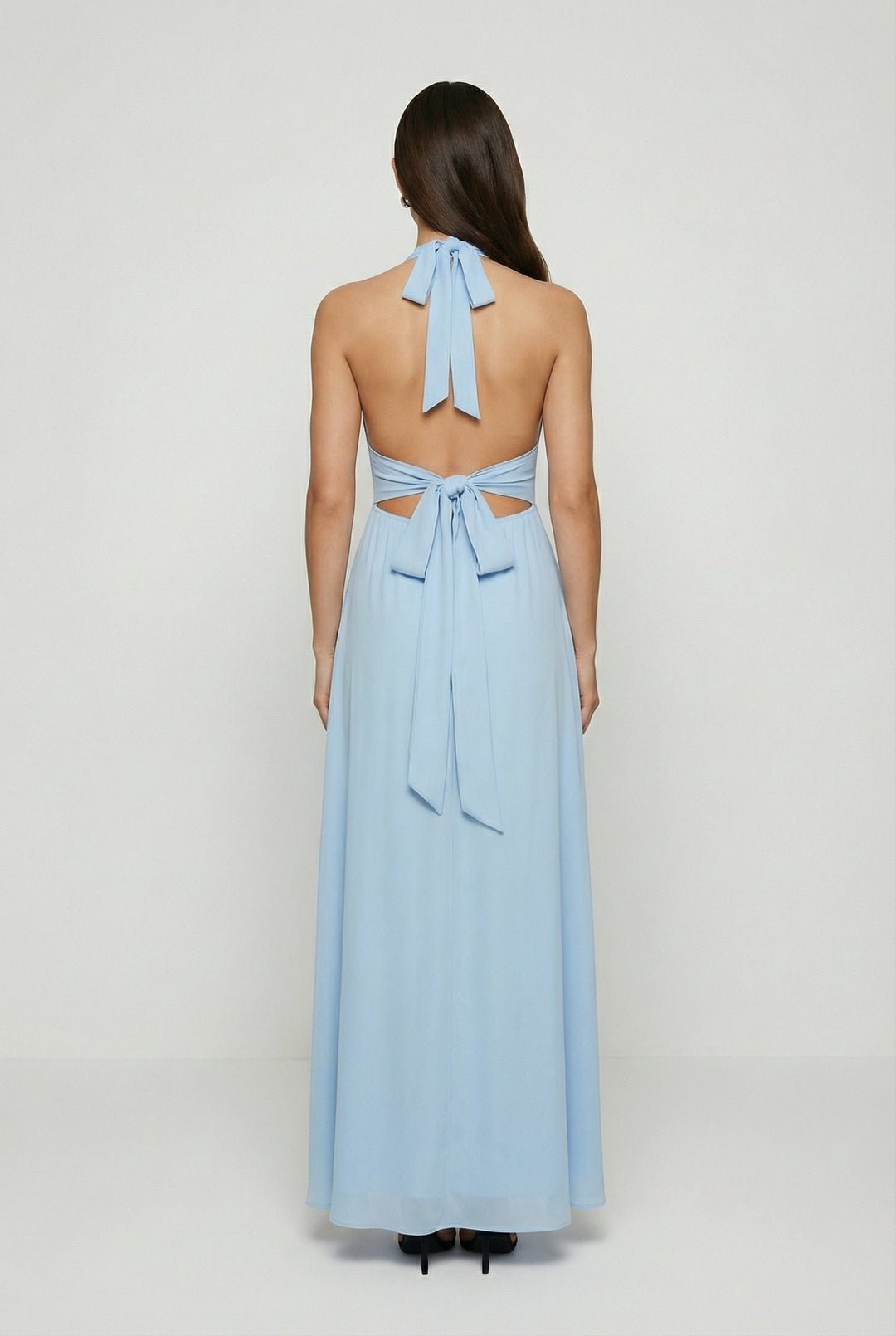 Stunning blue backless maxi dress with a flattering halter neckline, ideal for parties or summer occasions.