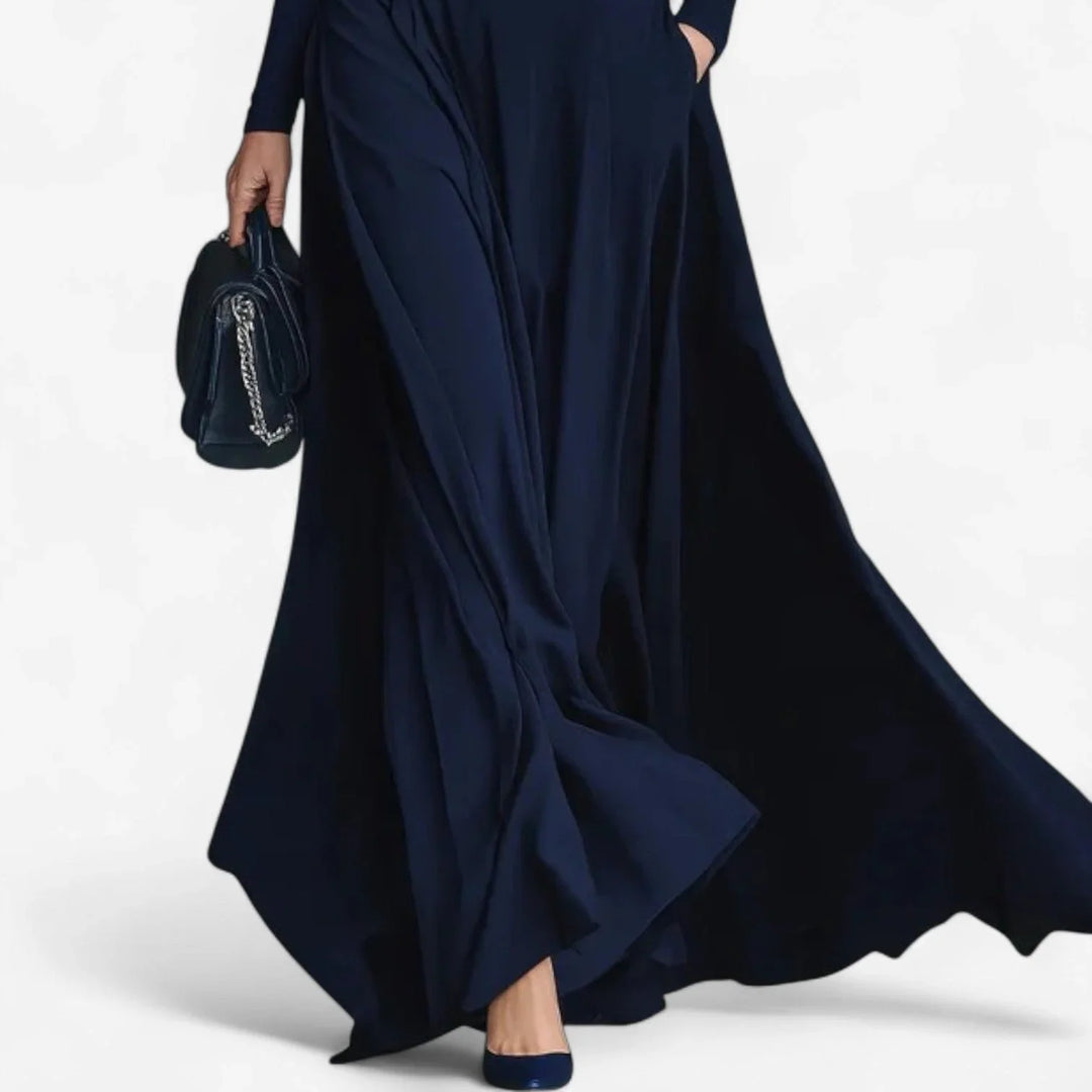 Modest women's long-sleeve high-neck maxi dress featuring a flattering belted A-line skirt in a chic blue color.