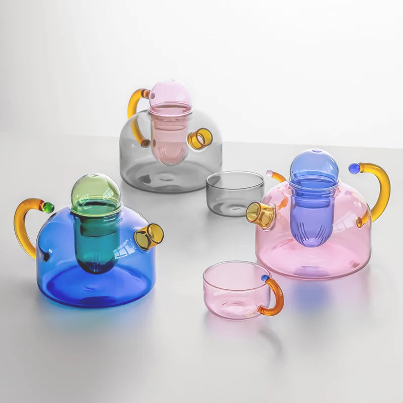 Elegant borosilicate glass tea set with teapot & cups. Perfect for tea enthusiasts, home decor & daily drinkware.