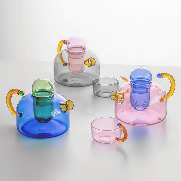 Elegant borosilicate glass tea set with teapot & cups. Perfect for tea enthusiasts, home decor & daily drinkware.