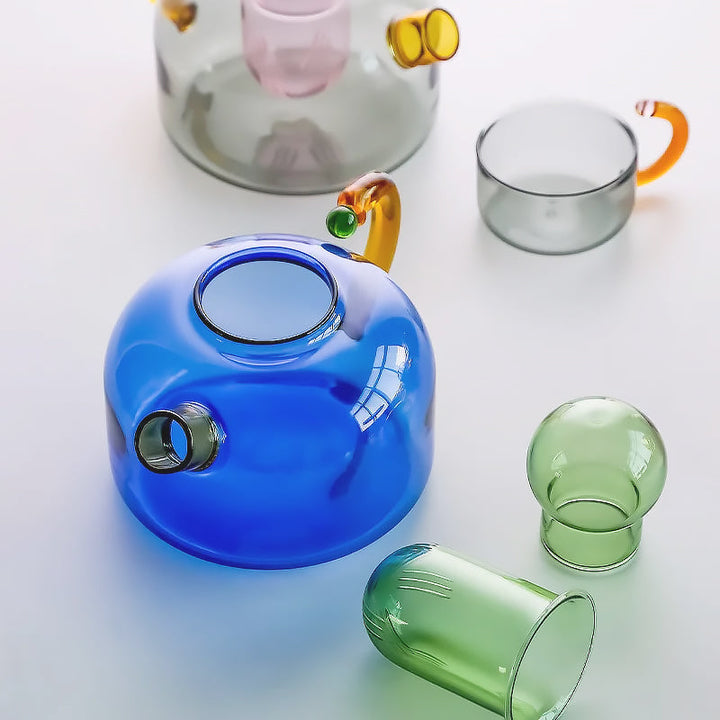 Clear borosilicate glass teapot with infuser, ideal for brewing loose leaf tea. Stylish & durable kitchenware.