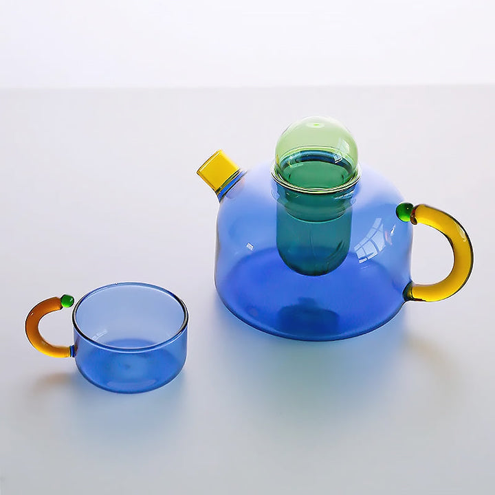 Delicate borosilicate glass tea cup, showcasing vibrant colorful tea. Elegant glassware for a modern home.