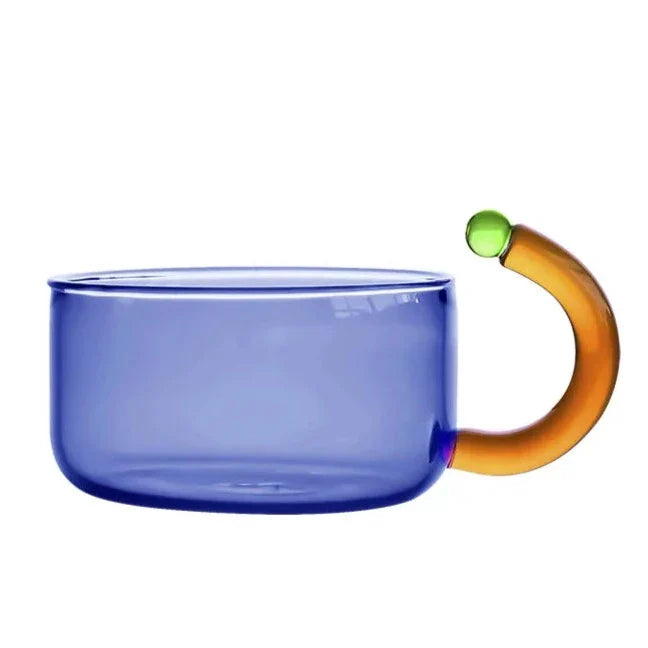 Hot tea steaming in a clear borosilicate glass teapot & cup. Cozy tea set for enthusiasts. Essential drinkware.