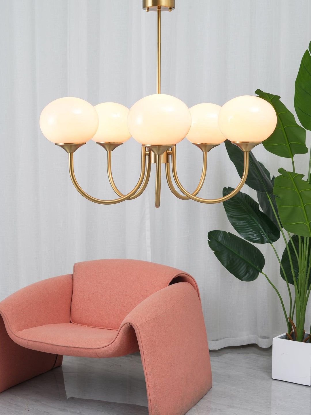 Modern chrome pendant, a circular ceiling light with opal glass for a chic interior.