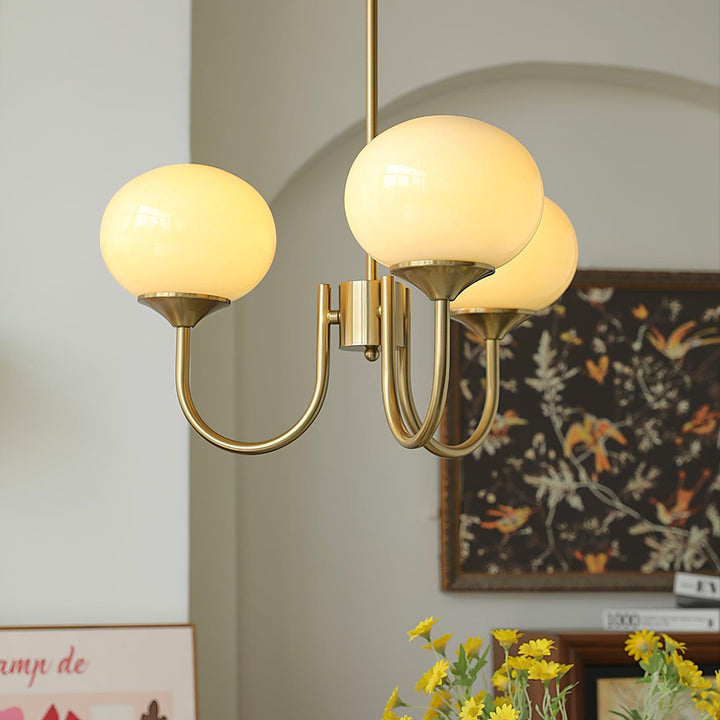 Luxurious chrome circular pendant lamp with glass spheres for a modern living area.