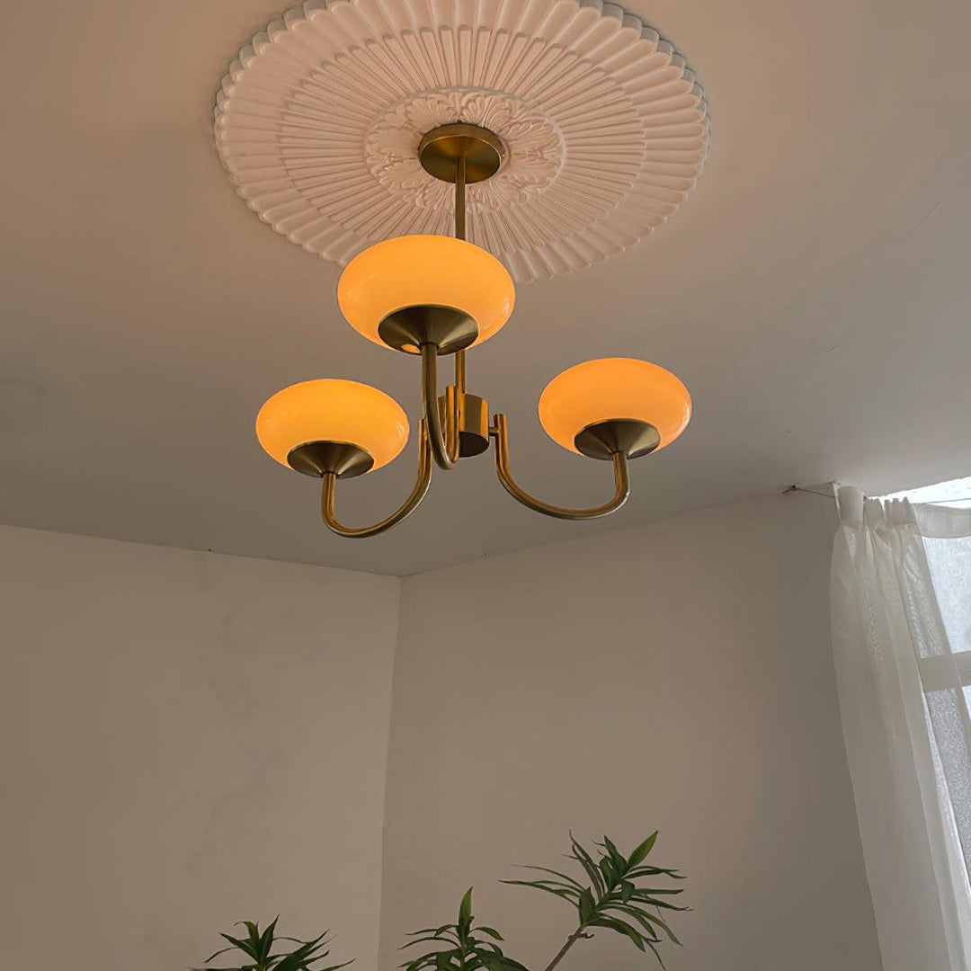 Contemporary chrome circular lamp with sleek design, perfect for modern dining rooms.
