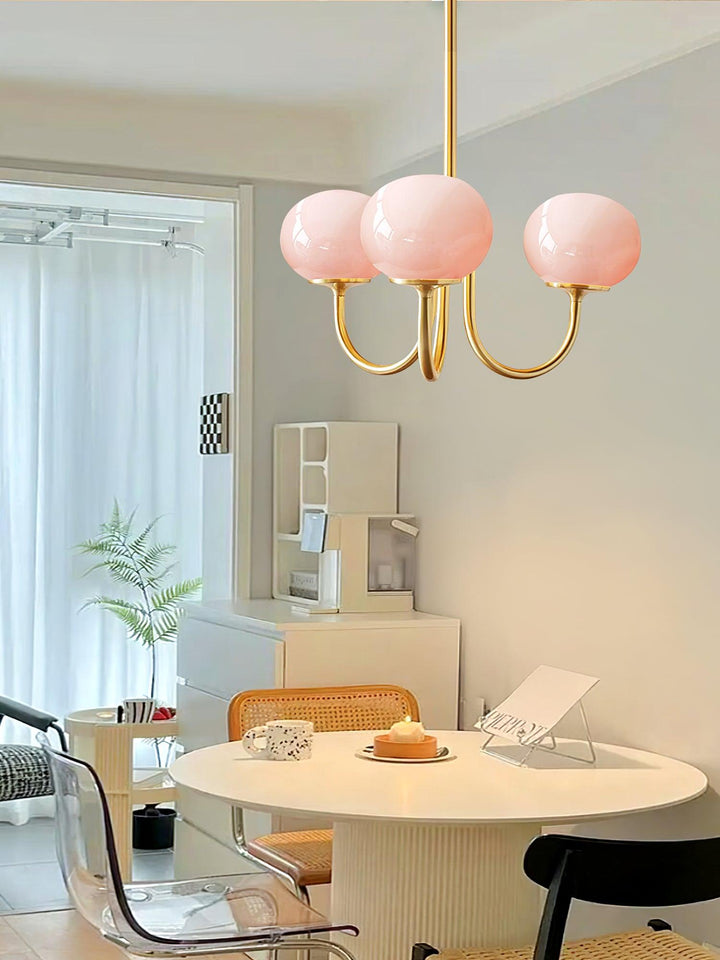 Sophisticated gold-finish ring pendant with glass spheres, a luxurious ceiling light.