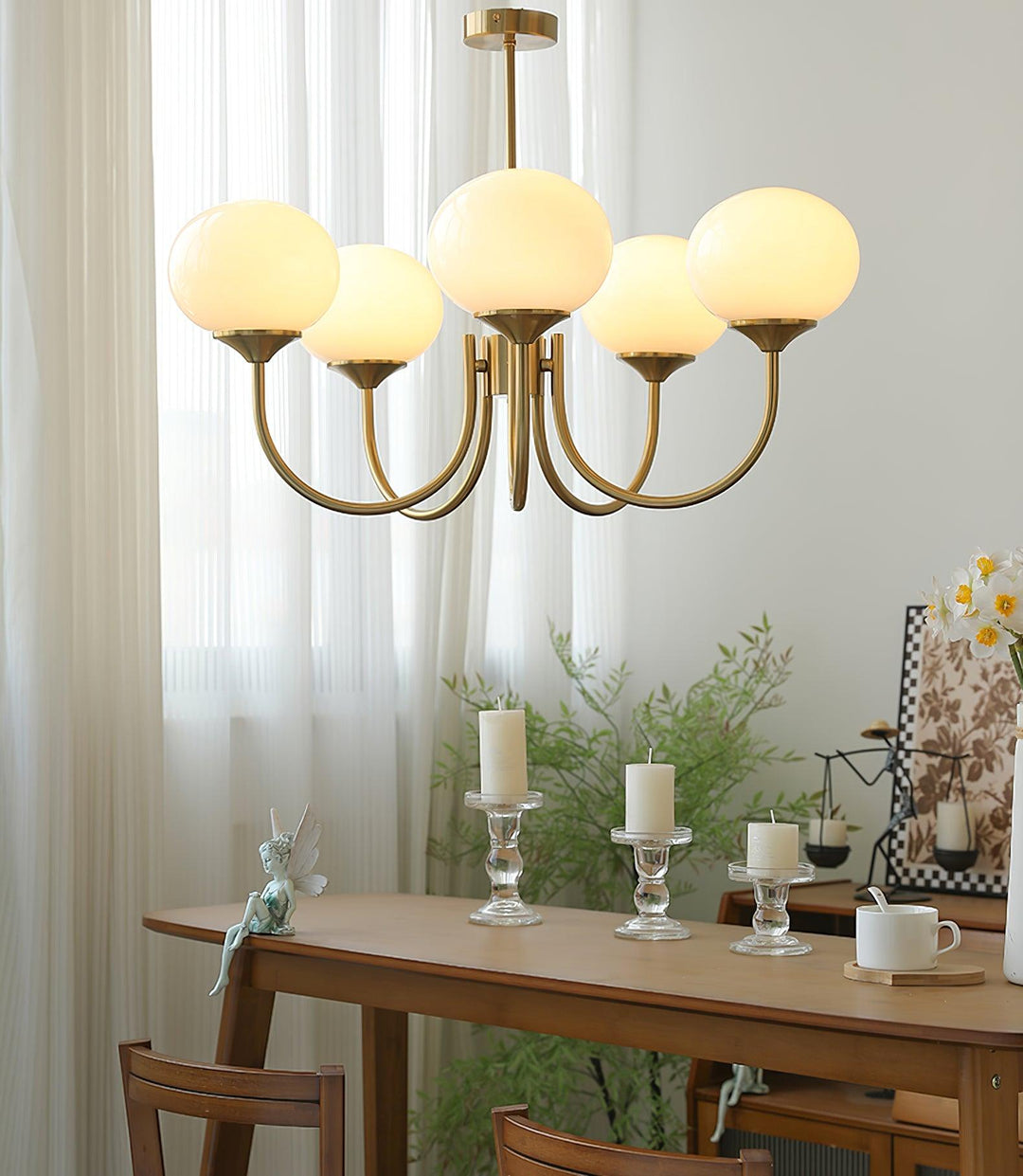 Luxurious silver-finish circular pendant, providing ambient light for modern homes.