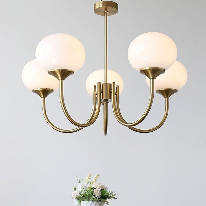 Stylish gold-finish circular pendant, a decorative light for contemporary interiors.