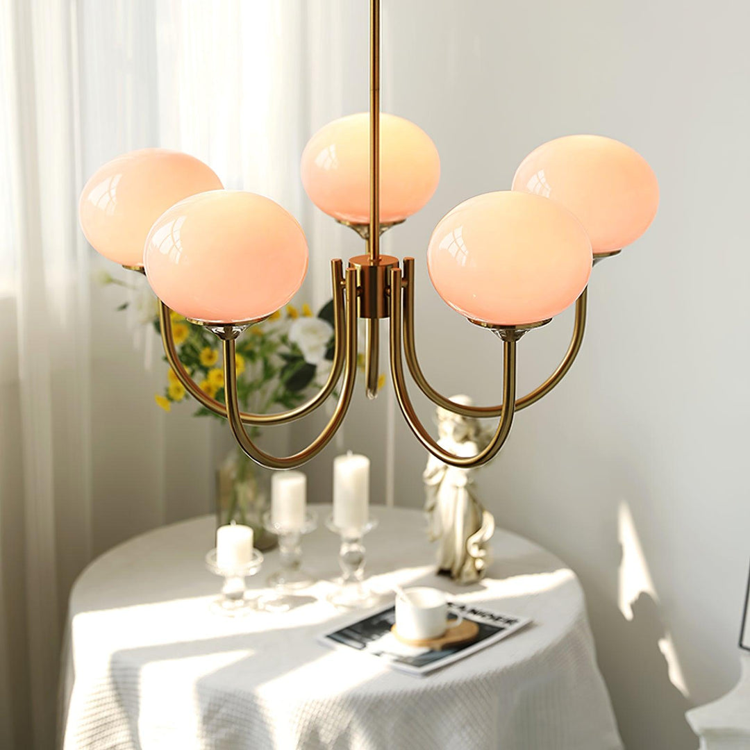 Chic silver-finish circle lamp, providing ambient light in a minimalist living room.