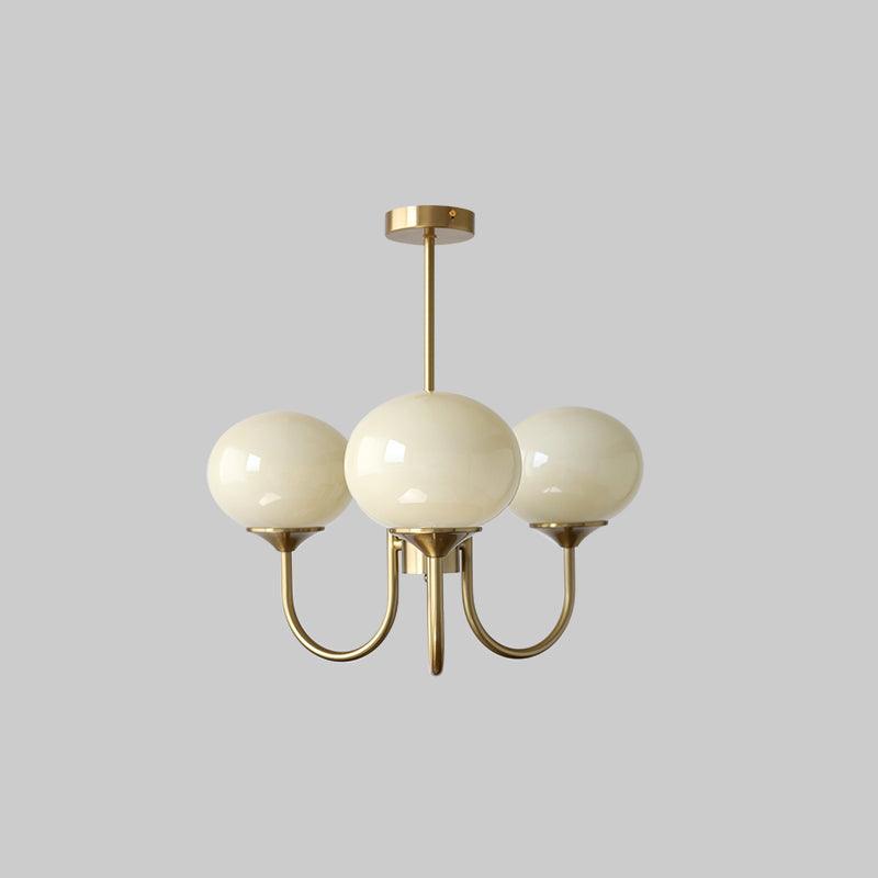 Sophisticated brass ring pendant with opal glass shades for elegant dining rooms.