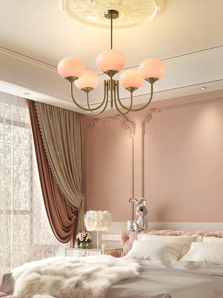 Stylish silver-finish ring pendant, ambient lighting with frosted glass shades.