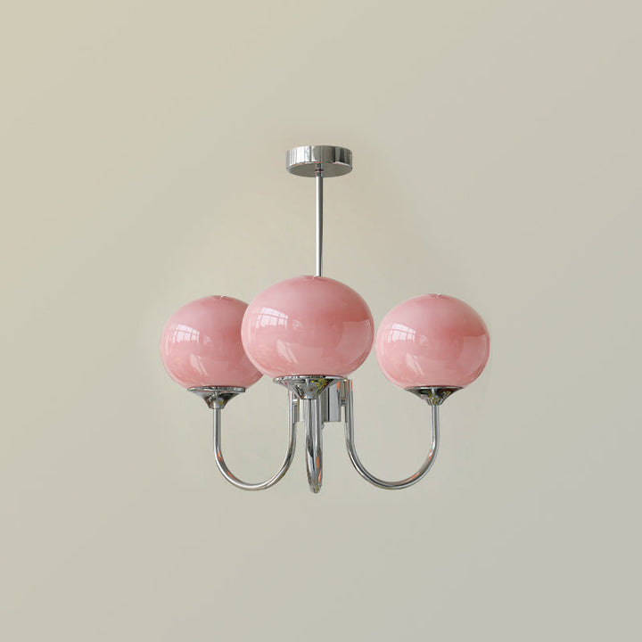 Contemporary gold-finish ring pendant, a stylish decorative piece for dining.