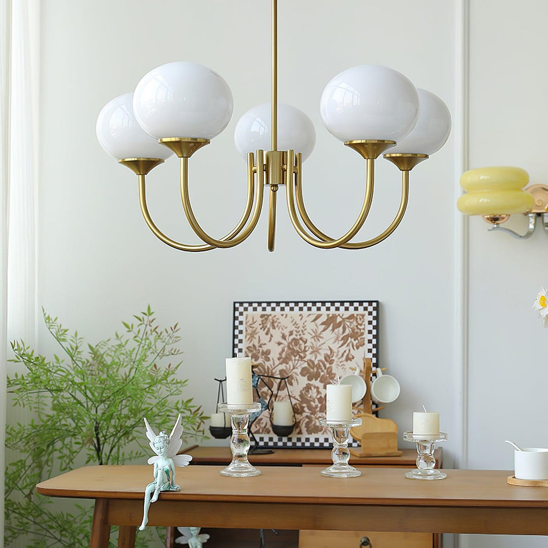 Unique chrome circular ceiling light with frosted glass shades for a stylish bedroom.