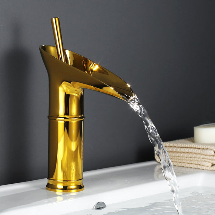Chrome waterfall bathroom sink mixer, sleek and modern design. Basin tap.