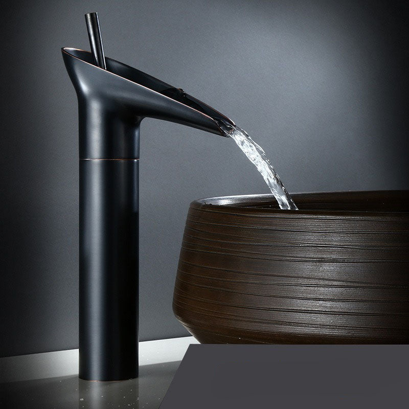 Stylish brass waterfall faucet for bathroom, elegant basin mixer tap.