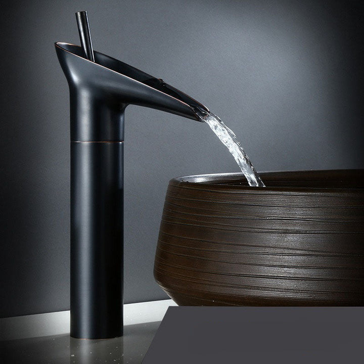 Stylish brass waterfall faucet for bathroom, elegant basin mixer tap.