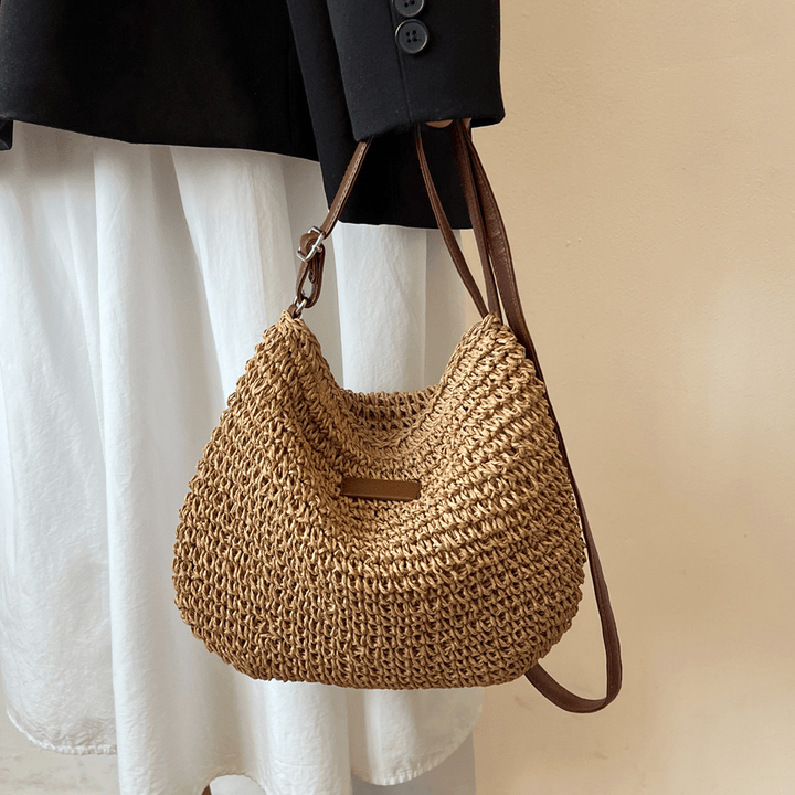 Elegant brown & beige women's versatile everyday handbag, a stylish fashion accessory.