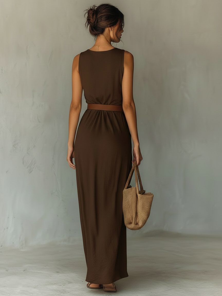 Flowy brown sleeveless maxi dress with cowl neck and belt, ideal for comfortable summer vacations and casual wear.