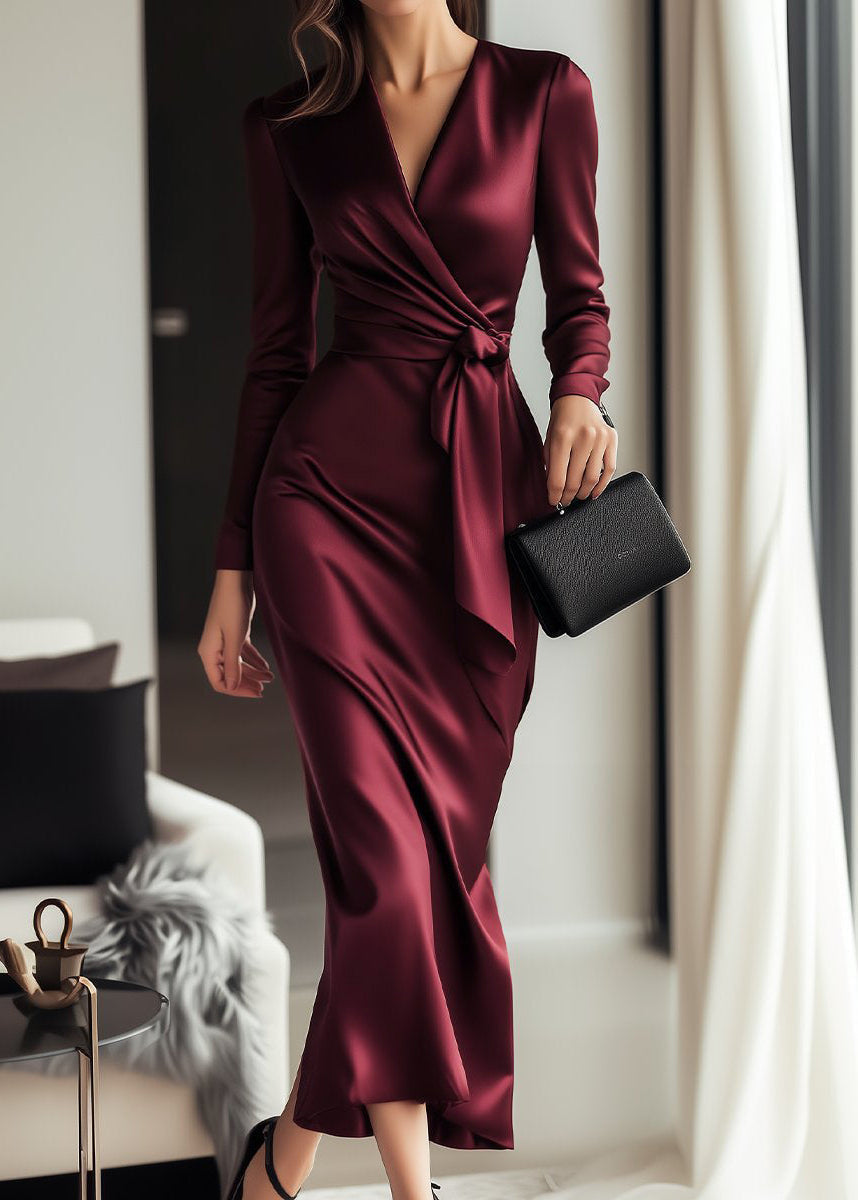 Elegant burgundy long sleeve wrap dress with V-neck and waist tie, perfect for a wedding guest or formal evening.