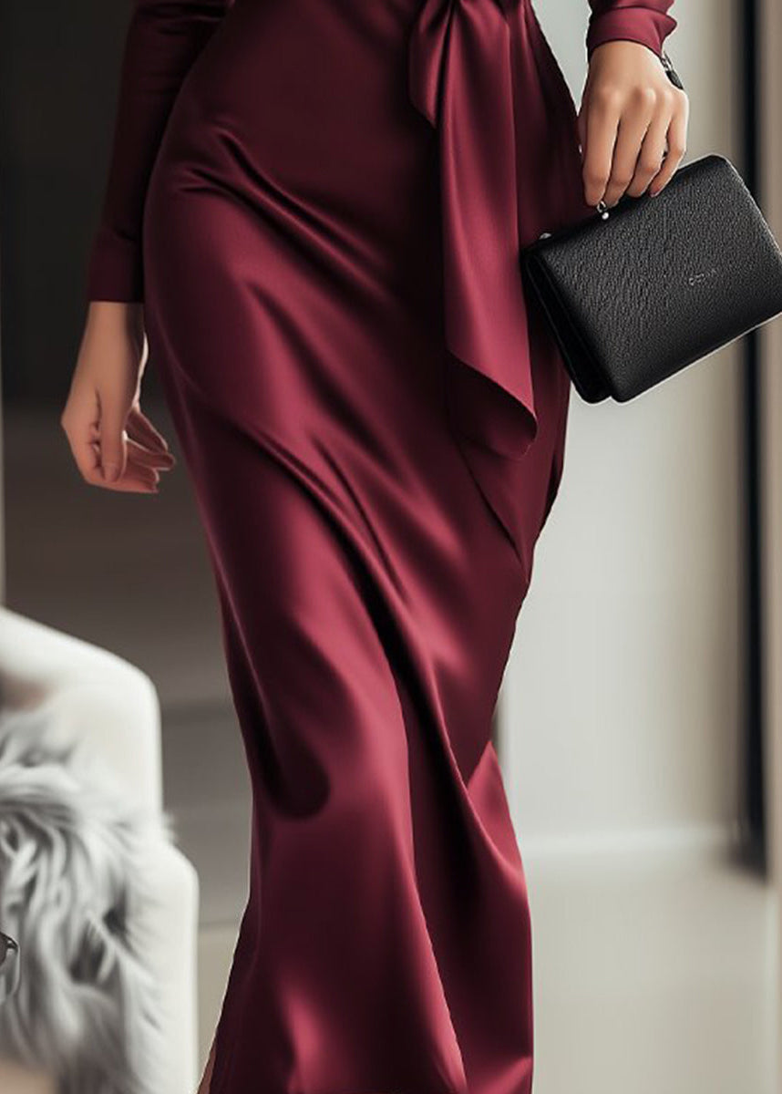 Stylish women's elegant long sleeve burgundy wrap dress. Ideal formal or evening wear, suitable for wedding guests.