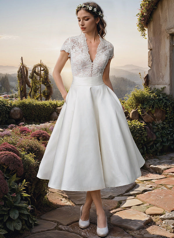 Elegant Carmen women's midi lace wedding dress with a flattering V-neckline, perfect for a garden bridal gown.