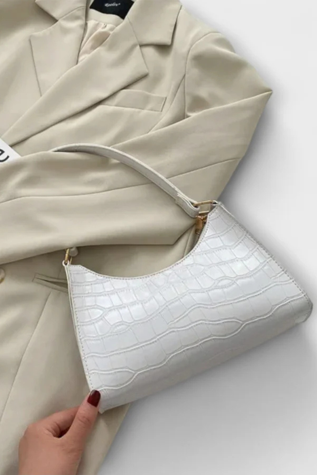 Modern classic women's textured shoulder bag, chic and practical for versatile styling.