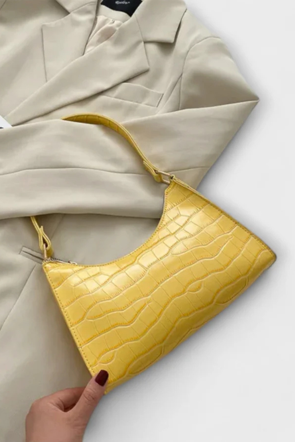 Stylish and chic women's textured shoulder bag, an elegant classic fashion accessory.