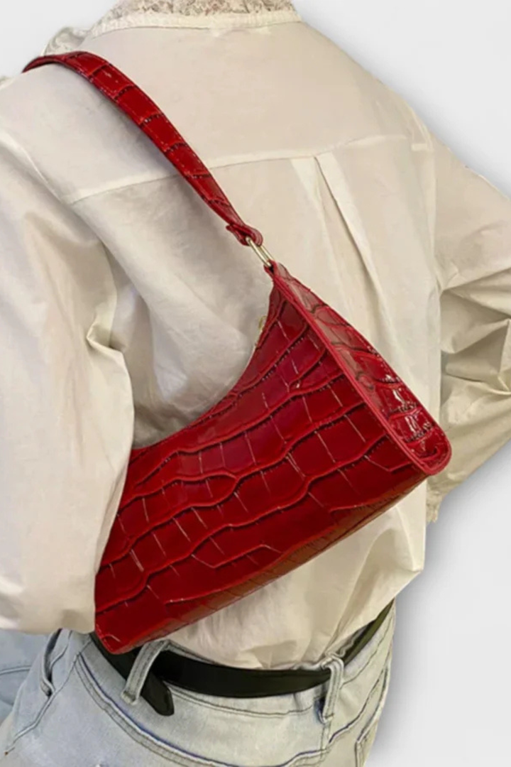 Classic women's textured shoulder bag, an elegant handbag for timeless fashion.