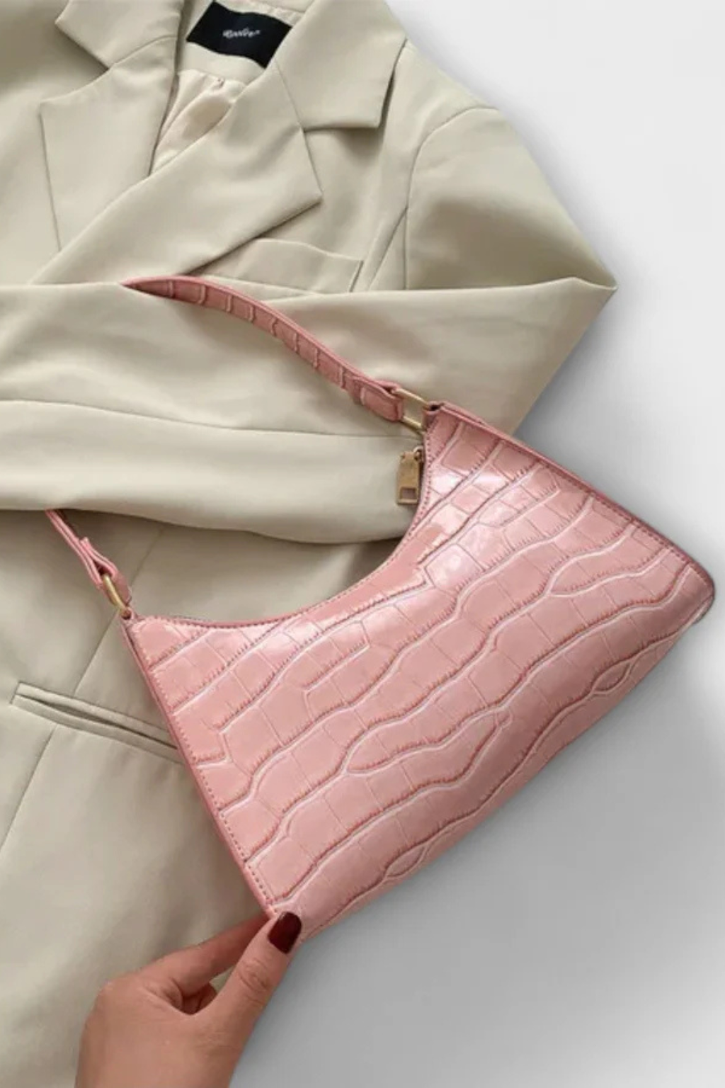 Sophisticated women's textured shoulder bag, a classic elegant handbag for stylish women.