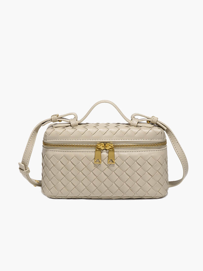 Detailed view of the woven texture on an elegant compact women's shoulder bag, a chic accessory.