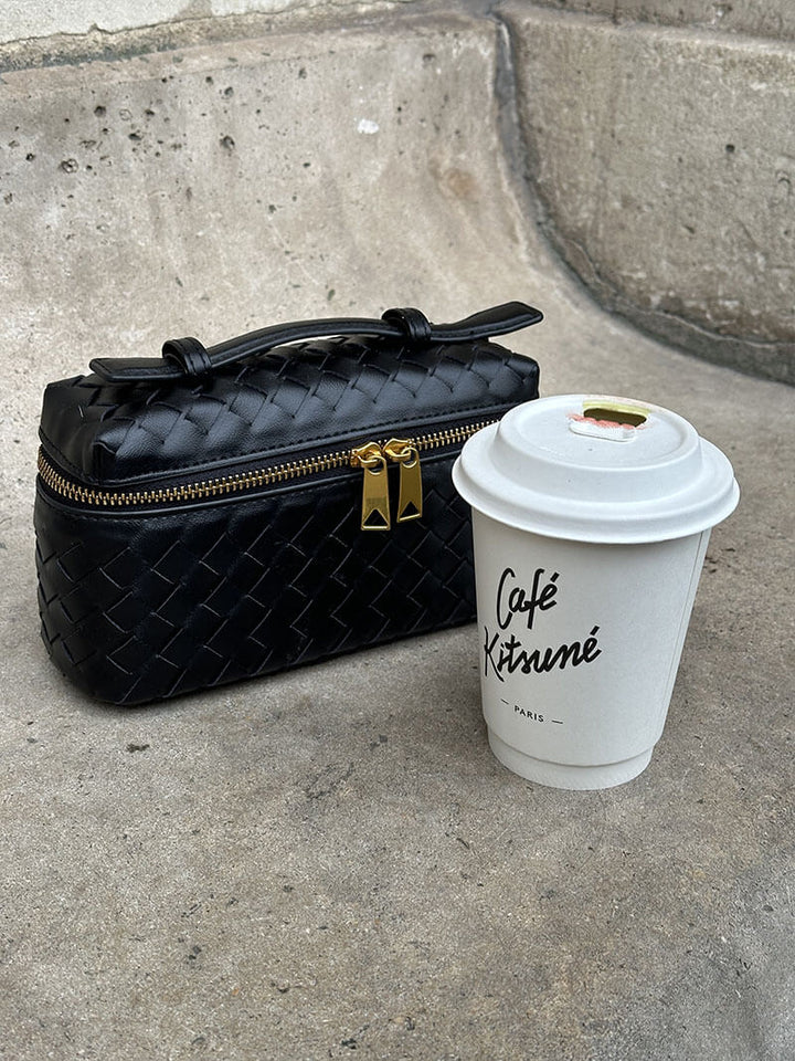 Chic modern women's compact shoulder bag with elegant woven texture, a stylish everyday accessory.