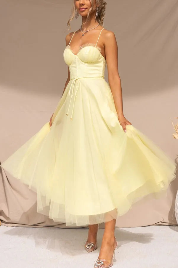 Women's fit-and-flare corset midi dress with spaghetti straps, flattering for special occasions.