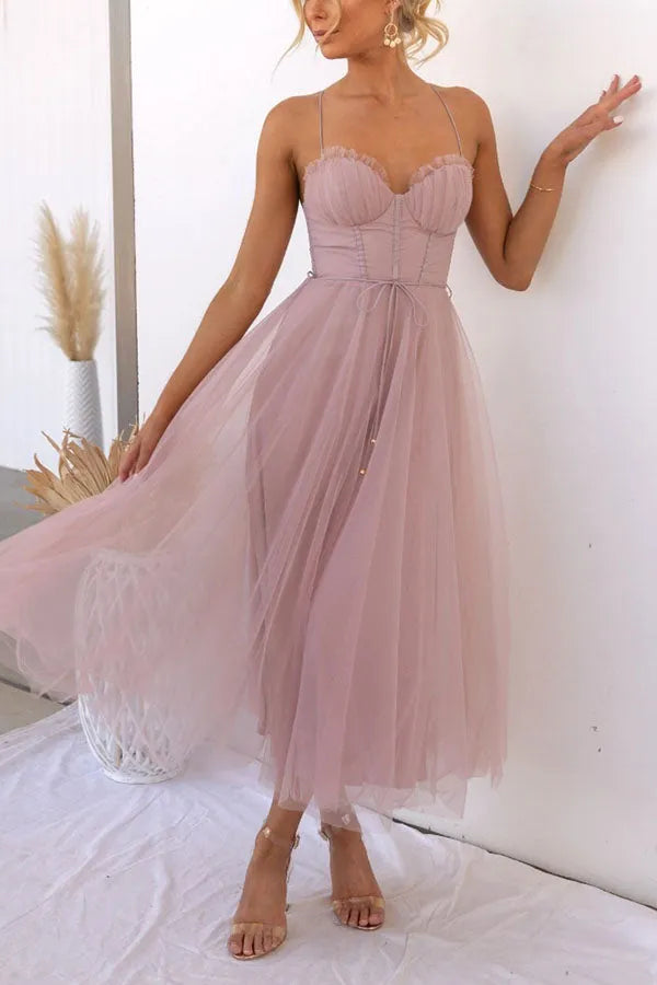 Wedding guest women's corset midi dress, featuring a flattering silhouette & spaghetti straps.