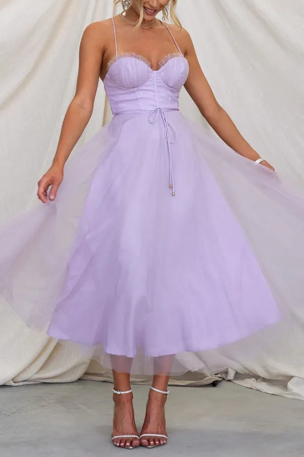 Modern women's party dress: an elegant corset midi with delicate spaghetti straps.
