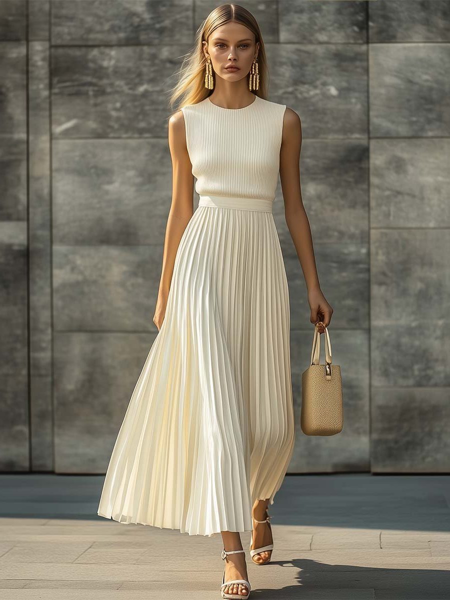 Sophisticated women's pleated maxi dress in cream. Sleeveless, elegant design suitable for formal occasions & parties.