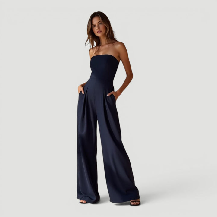 Elegant dark blue women's strapless wide leg jumpsuit. Perfect for evening wear, parties, or summer casual chic.