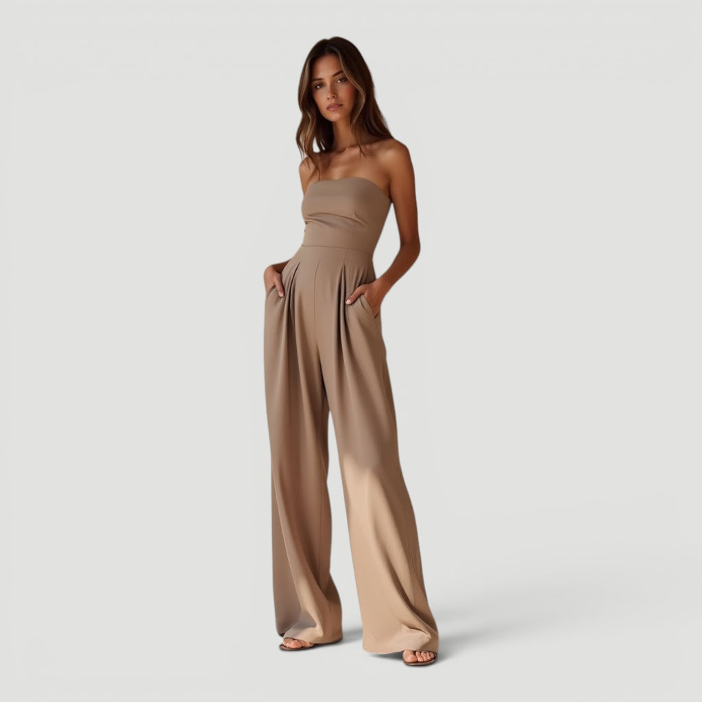 Black wide leg strapless jumpsuit for women, offering timeless style & comfort. Ideal for summer parties.
