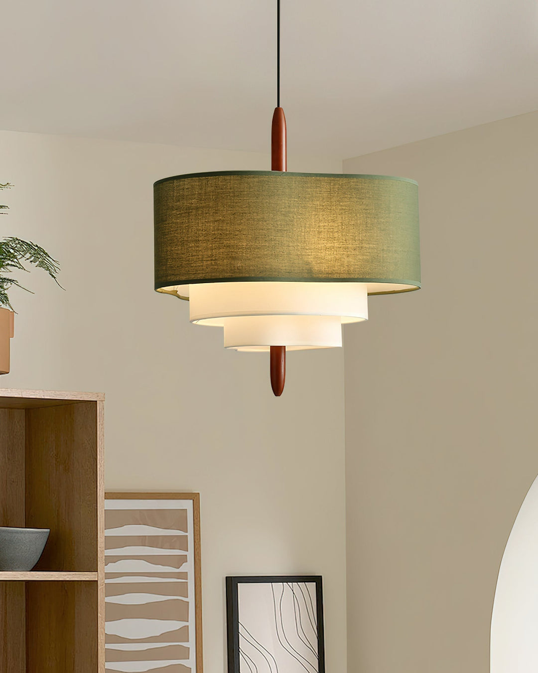 Elegant fabric drum pendant light with wood base. Ideal for dining areas.