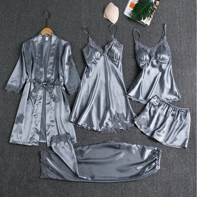 Close-up of elegant five-piece women's satin pyjama set, showcasing luxury fabric and comfortable design.