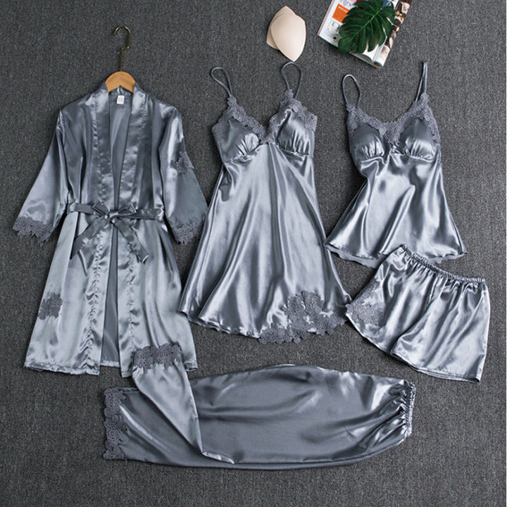 Close-up of elegant five-piece women's satin pyjama set, showcasing luxury fabric and comfortable design.