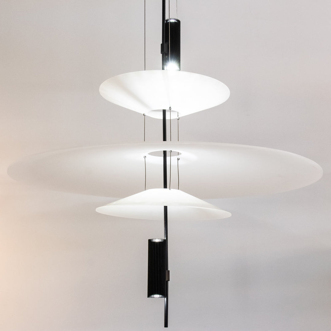 Elegant floating disc pendant, black finish, integrated LED, ideal for modern decor.