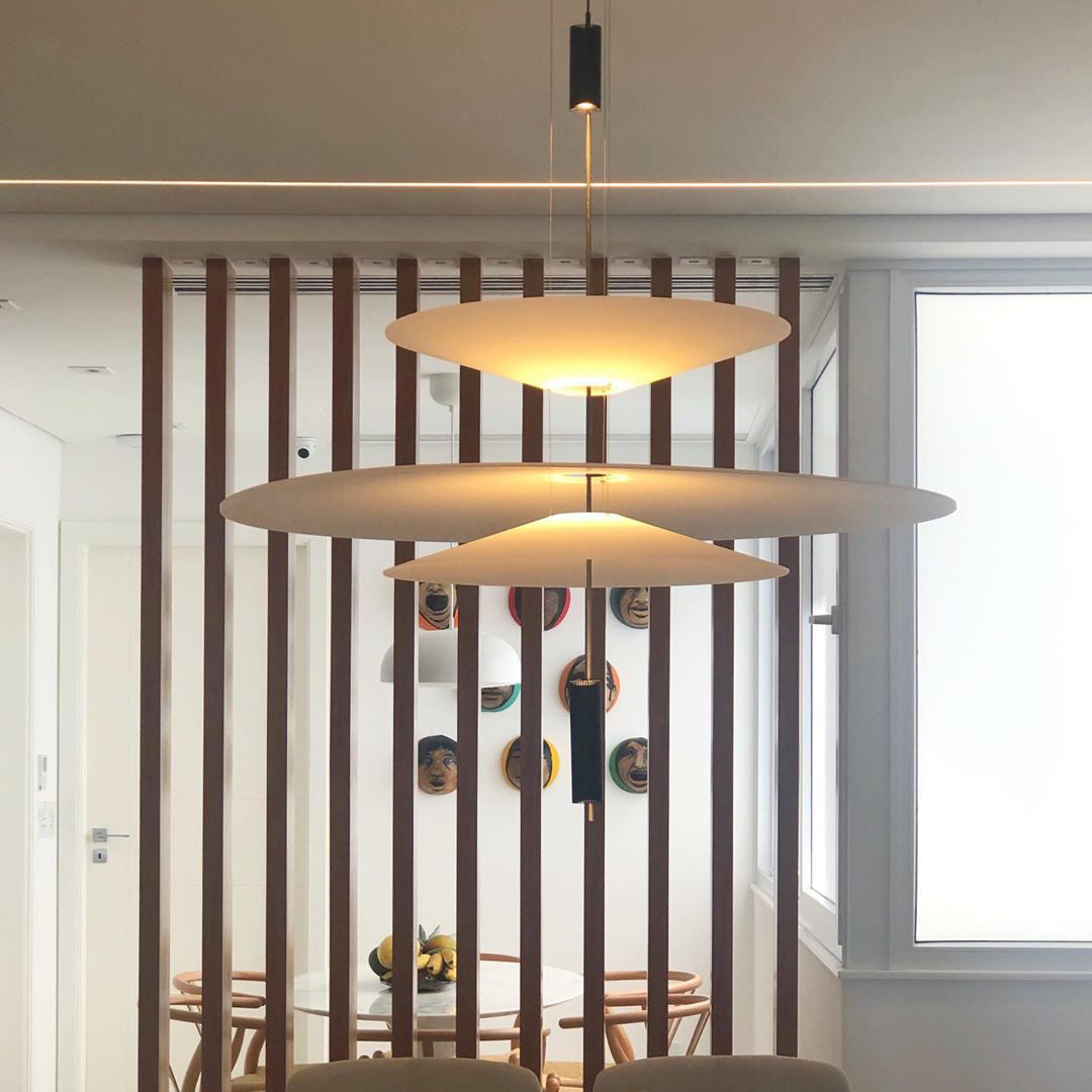 Sleek gold disc pendant, integrated LED, elegant modern lighting for any room.